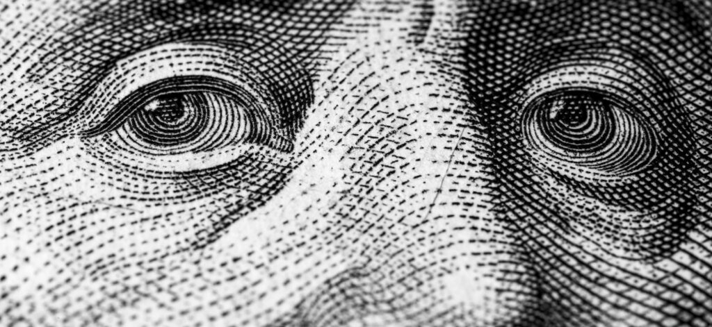 dollar bill zoomed in to George Washington's eyes
