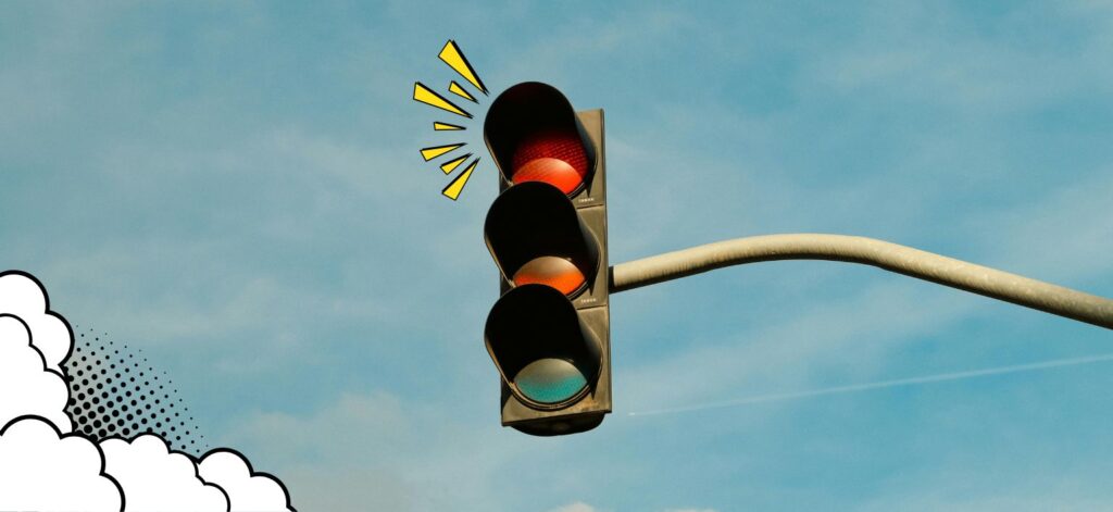 Red stop light with flashing motion lines